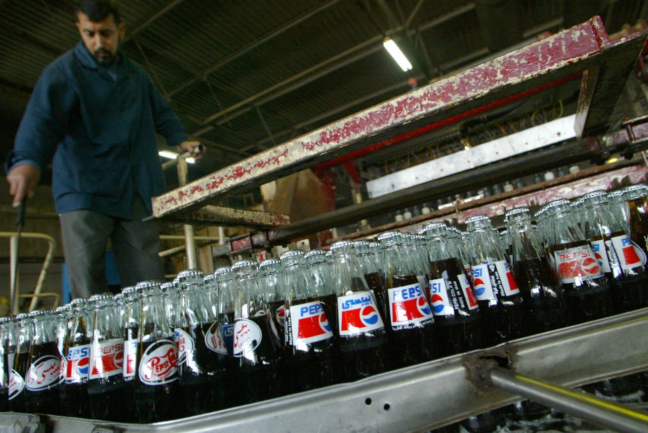 PepsiCo's products move through large-scale production lines before reaching stores, making accurate labels and production codes essential for tracing specific batches when a recall is issued. | Source: Getty Images