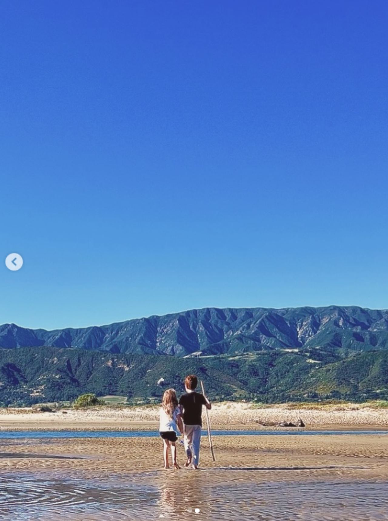 Prince Archie and Princess Lilibet are pictured walking together along the water, a glimpse of the siblings that underscores why their parents have been so protective of their privacy. | Source: Instagram/meghan