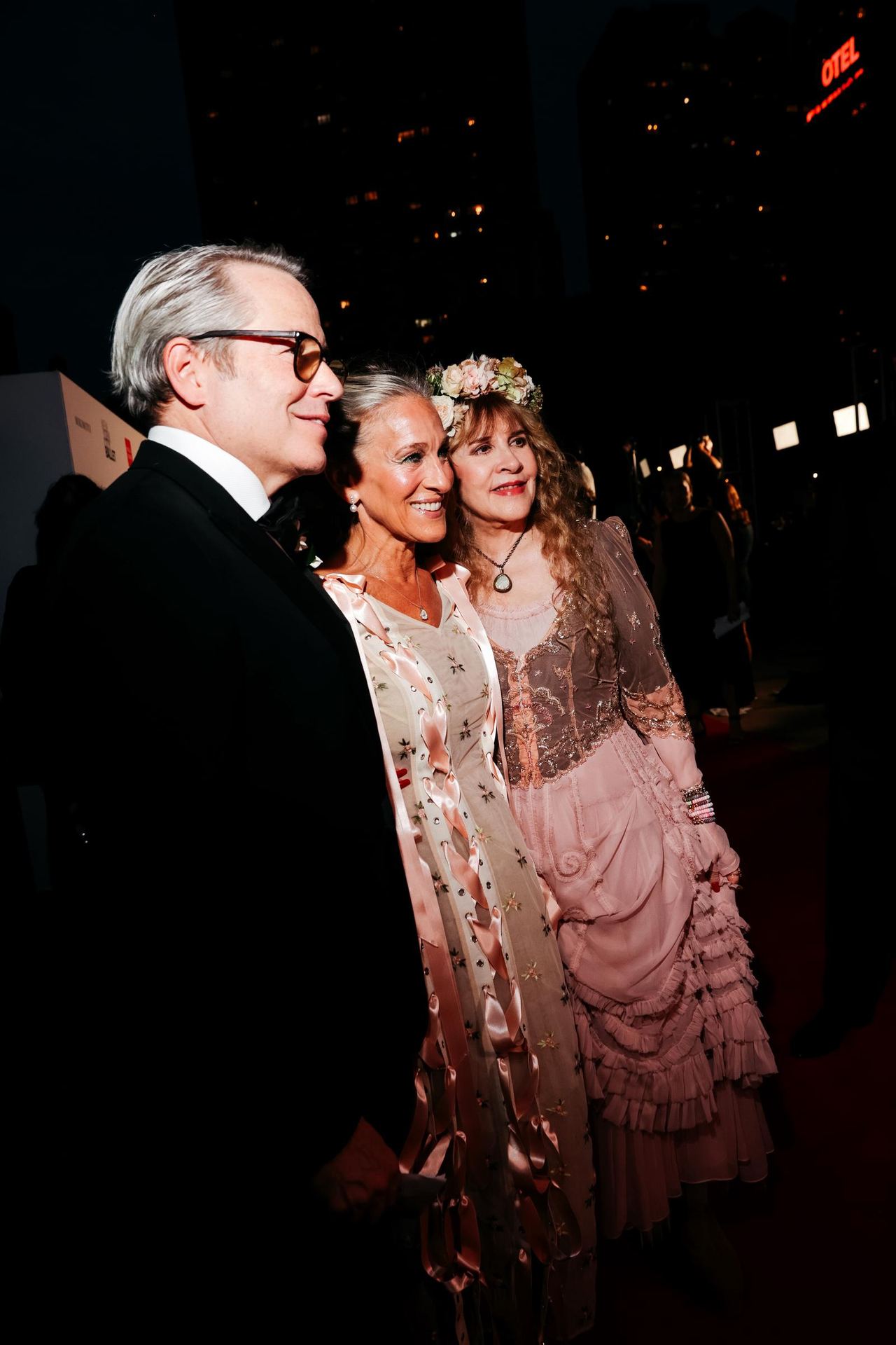 Matthew Broderick, Sarah Jessica Parker, and Stevie Nicks pose together at the New York City Ballet 2026 Fall Fashion Gala, as Parker's floral embroidery and pink ribbon details offer another glimpse of her elaborate ensemble. | Source: Getty Images