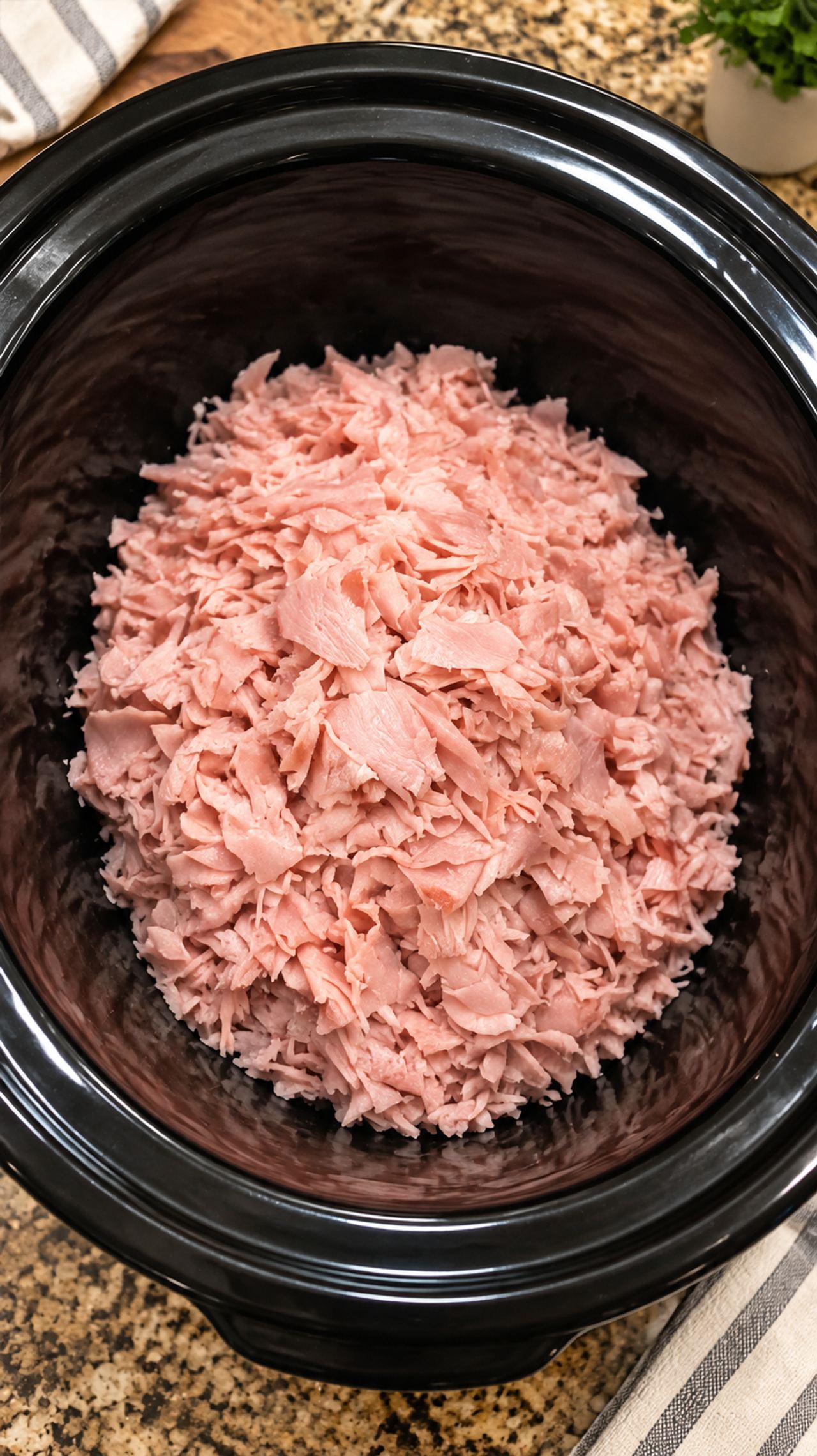 Throw a pile of shaved deli ham into the slow cooker with 3 other ingredients and make a m