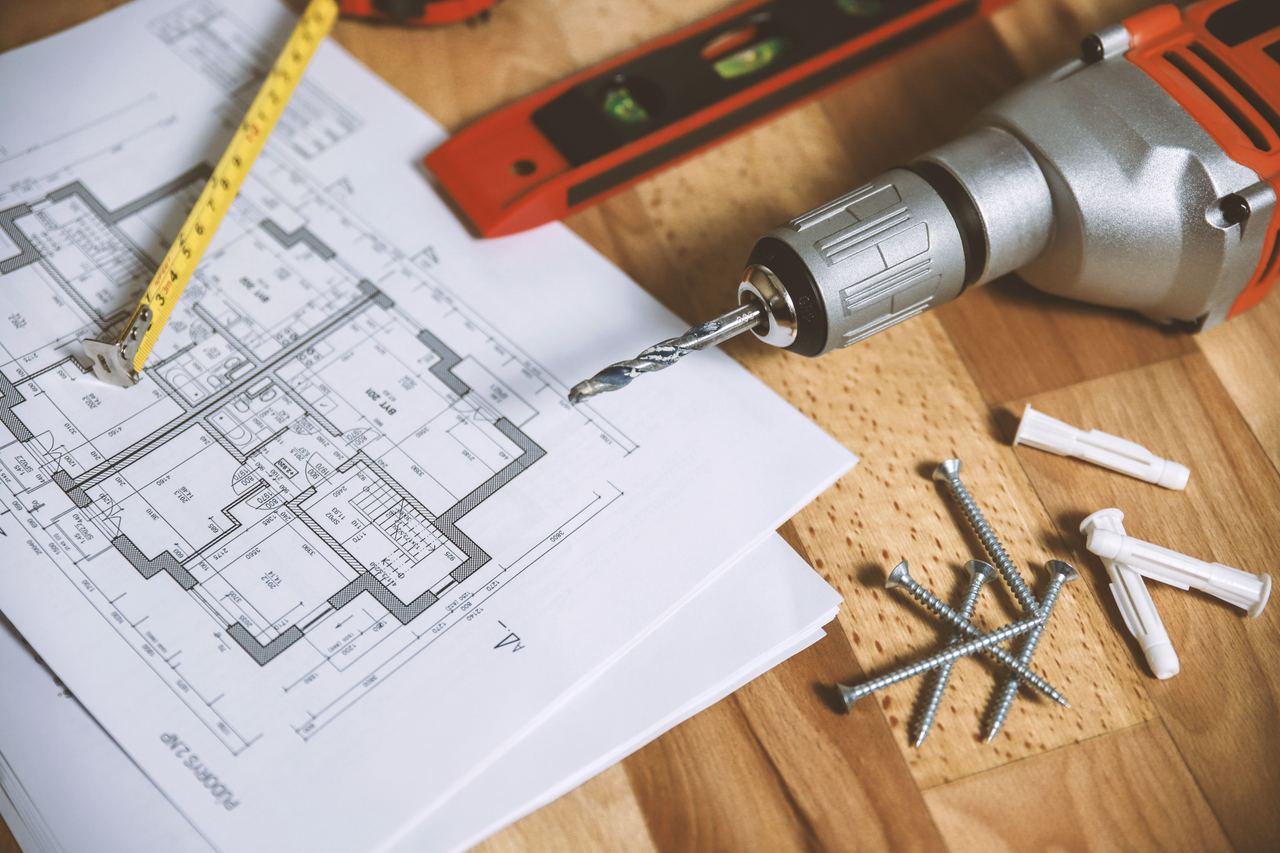 Construction drawings with tools | Source: Pexels